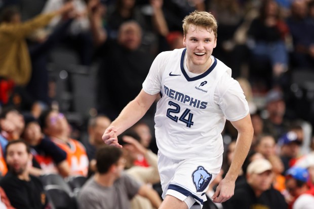 Memphis Grizzlies guard Cam Spencer gestures after making a 3-point...