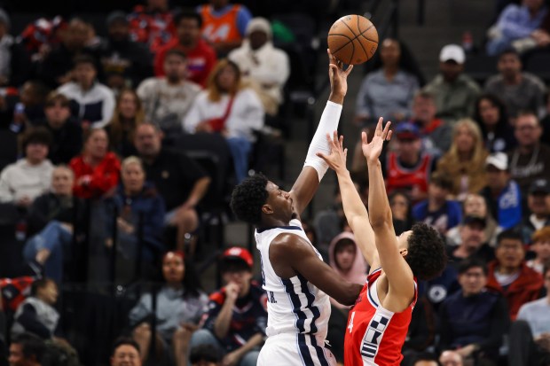 Memphis Grizzlies forward Jaren Jackson Jr., left, shoots against Clippers...