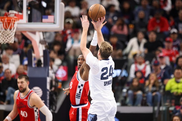 Memphis Grizzlies guard Cam Spencer (24) shoots against Clippers guard...