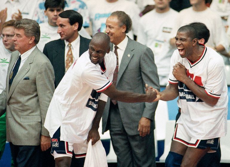 Lenny Wilkins, Michael Jordan and Earvin Johnson react.
