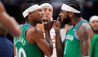 Dallas Mavericks' Brandon Williams (10) and Jaden Hardy, right, celebrate during a time out in the first half of an NBA basketball game against the Phoenix Suns Thursday,Nov. 13, 2025, in Dallas. (AP Photo/Tony Gutierrez)