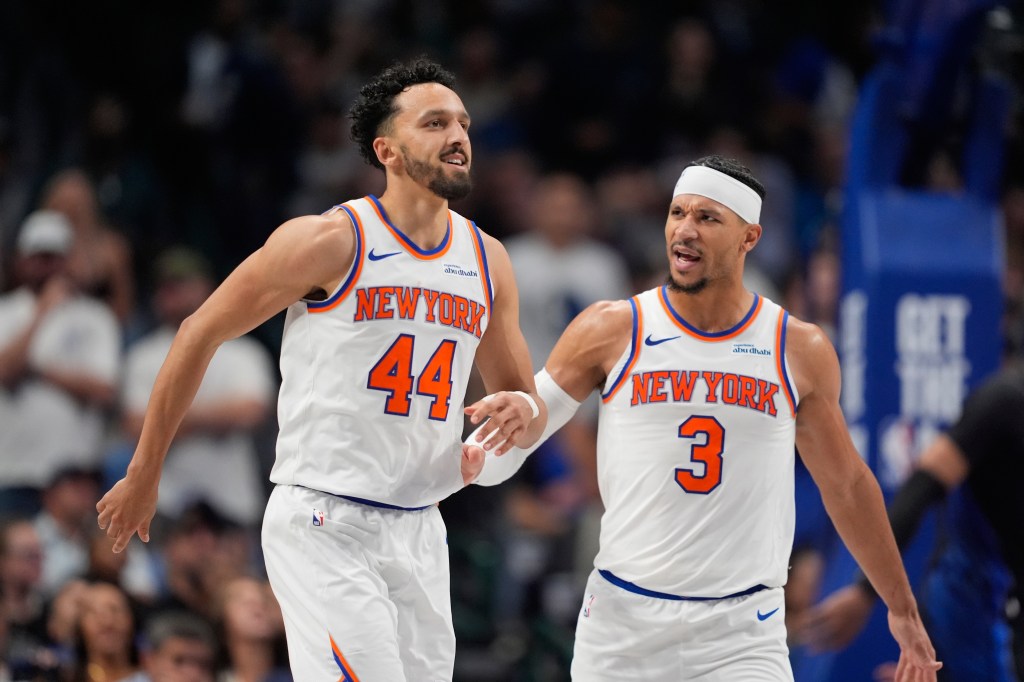 guard Landry Shamet (44) is congratulated by teammate Josh Hart (3) after Shemet scored a three pointer in the second half of an NBA basketball game against the Dallas Mavericks Wednesday, Nov. 19, 2025, in Dallas.