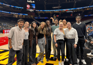 Students on Atlanta Hawks basketball court during shoot around.