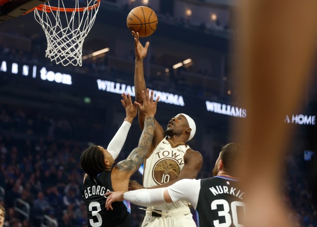 Golden State Warriors' Jimmy Butler (10) takes a shot against...