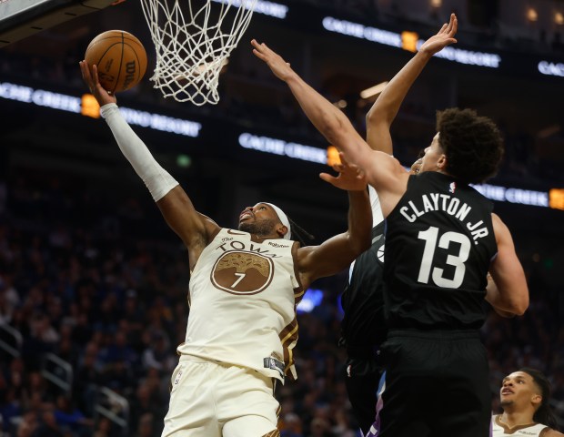 Golden State Warriors' Buddy Hield (7) takes a shot against...