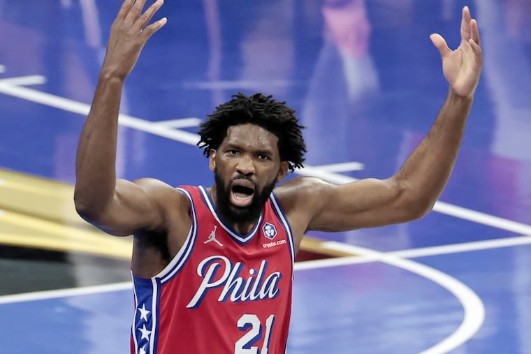 Sixers Joel Embiid tries to get the fans up in the second half of the Boston Celtics at Philadelphia 76ers NBA game at Xfinity Mobile Arena in Philadelphia on Friday, Oct. 31, 2025.