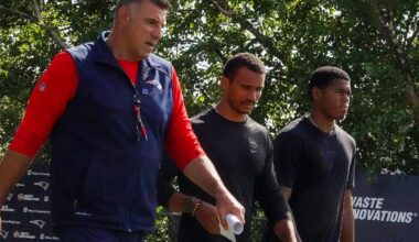 The Celtics' Joe Mazzulla (center) and his stepson, Michael Holden, visited with Mike Vrabel (left) at Patriots training camp in July.