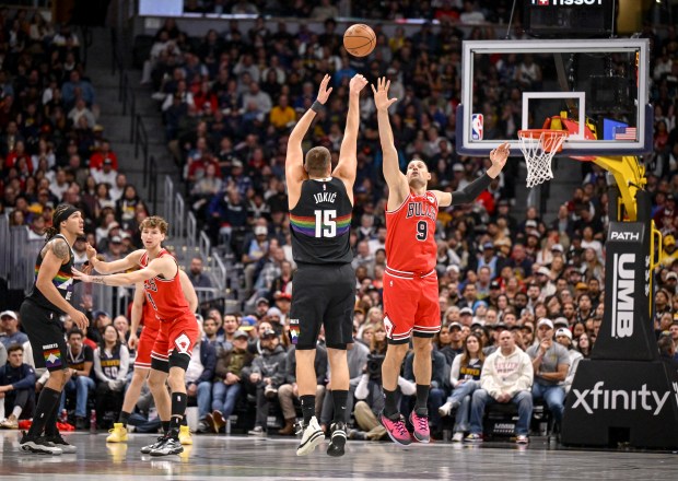 Nuggets' Nikola Jokić shoots over the Bulls' Nikola Vučević during the second quarter at Ball Arena in Denver on Nov. 17, 2025. (Photo by AAron Ontiveroz/The Denver Post)