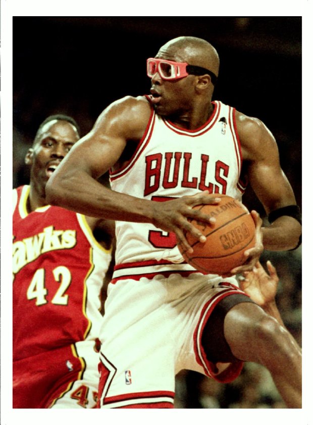 Bulls' Horace Grant grabs a rebound in front of Atlanta...