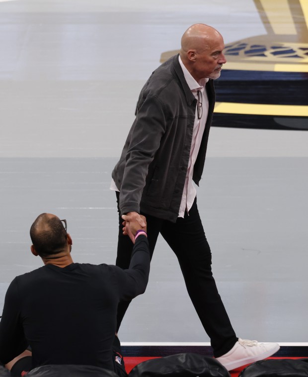 Former Bulls player and executive John Paxson greets a colleague before a game against the Heat at the United Center on Nov. 21, 2025, in Chicago. (John J. Kim/Chicago Tribune)