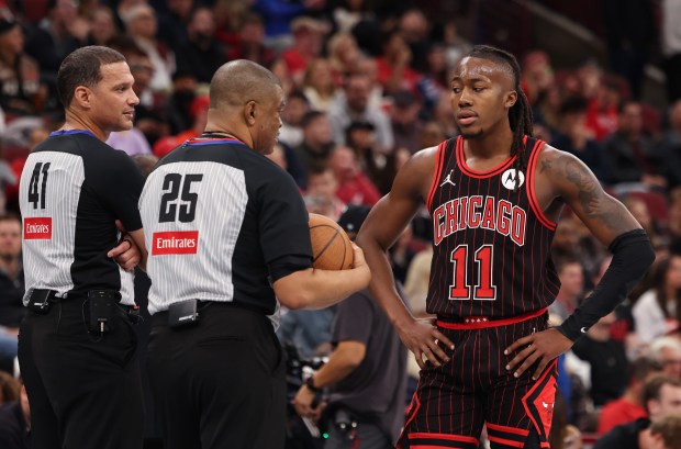 Bulls guard Ayo Dosunmu talks with officals during a timeout in the fourth quarter against the Heat at the United Center on Nov. 21, 2025, in Chicago. (John J. Kim/Chicago Tribune)