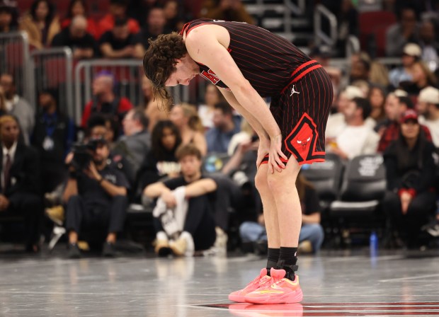 Bulls guard Josh Giddey pauses after getting hit in the face by Heat forward Keshad Johnson in the fourth quarter at the United Center on Nov. 21, 2025, in Chicago. (John J. Kim/Chicago Tribune)
