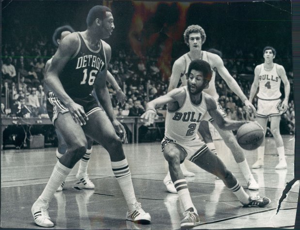 Norm Van Lier of bulls tries to maneuever past Bob Lanier [No. 16} of Detroit Pistons. Chicago Tribune photo by Ed Feeney published January 29, 1973Date Created: 1973-01-28 Copyright Notice: Chicago Tribune Folder Description: Chicago Bulls Folder Extended Description: Basketball Team 1973 Title: CHICAGO BULLS BASKETBALL TEAM 1973 Subject: CHICAGO BULLS