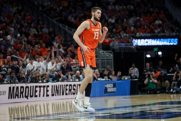 Illinois Fighting Illini center Tomislav Ivisic (13) celebrates after making a shot during the first half against the Kentucky Wildcats in round two of the NCAA tournament at Fiserv Forum Sunday March 23, 2025, in Milwaukee. (Armando L. Sanchez/Chicago Tribune)