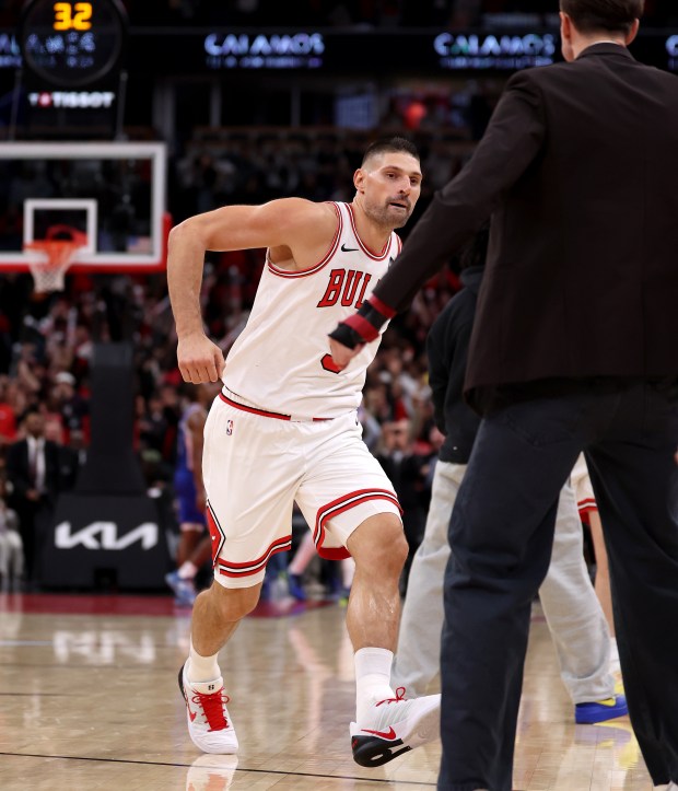 Chicago Bulls center Nikola Vučević (9) celebrates after hitting the game-winning 3-pointer in the second half of a game against the Philadelphia 76ers at the United Center in Chicago on Nov. 4, 2025. (Chris Sweda/Chicago Tribune)