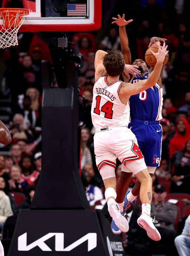 Chicago Bulls forward Matas Buzelis (14) has his layup attempt blocked by Philadelphia 76ers guard Tyrese Maxey (0) late in the second half of a game at the United Center in Chicago on Nov. 4, 2025. (Chris Sweda/Chicago Tribune)