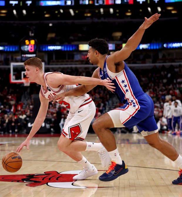 Chicago Bulls guard/forward Kevin Huerter (13) drives on Philadelphia 76ers guard Quentin Grimes (5) in the first half of a game at the United Center in Chicago on Nov. 4, 2025. (Chris Sweda/Chicago Tribune)