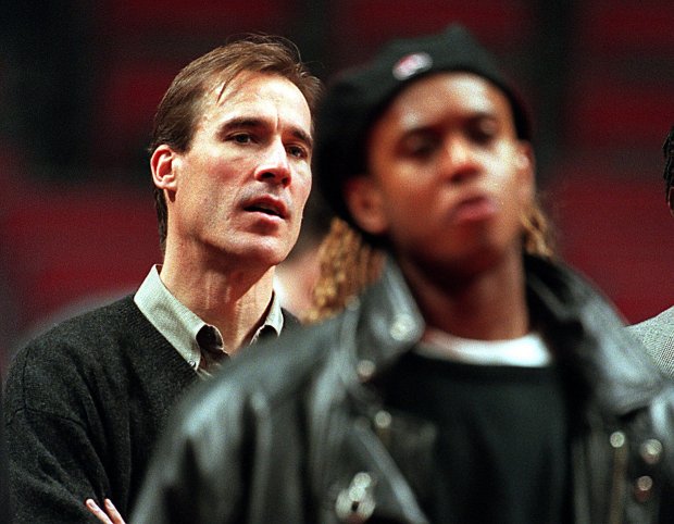 Former Bulls guards John Paxson (left) and B.J. Armstrong listen...