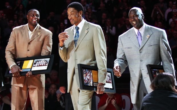 Former Bulls players Horace Grant, from left, Scottie Pippen and Michael Jordan have a laugh as the organization commemorates the 20th anniversary of the franchise's first NBA championship in 1991. The ceremony took place at halftime of a Bulls -Jazz game on March 12, 2011, at the United Center. (Chris Sweda/ Chicago Tribune) B58839173Z.1 BULLSJAZZ ....OUTSIDE TRIBUNE CO.- NO MAGS, NO SALES, NO INTERNET, NO TV, NEW YORK TIMES OUT, CHICAGO OUT, NO DIGITAL MANIPULATION...