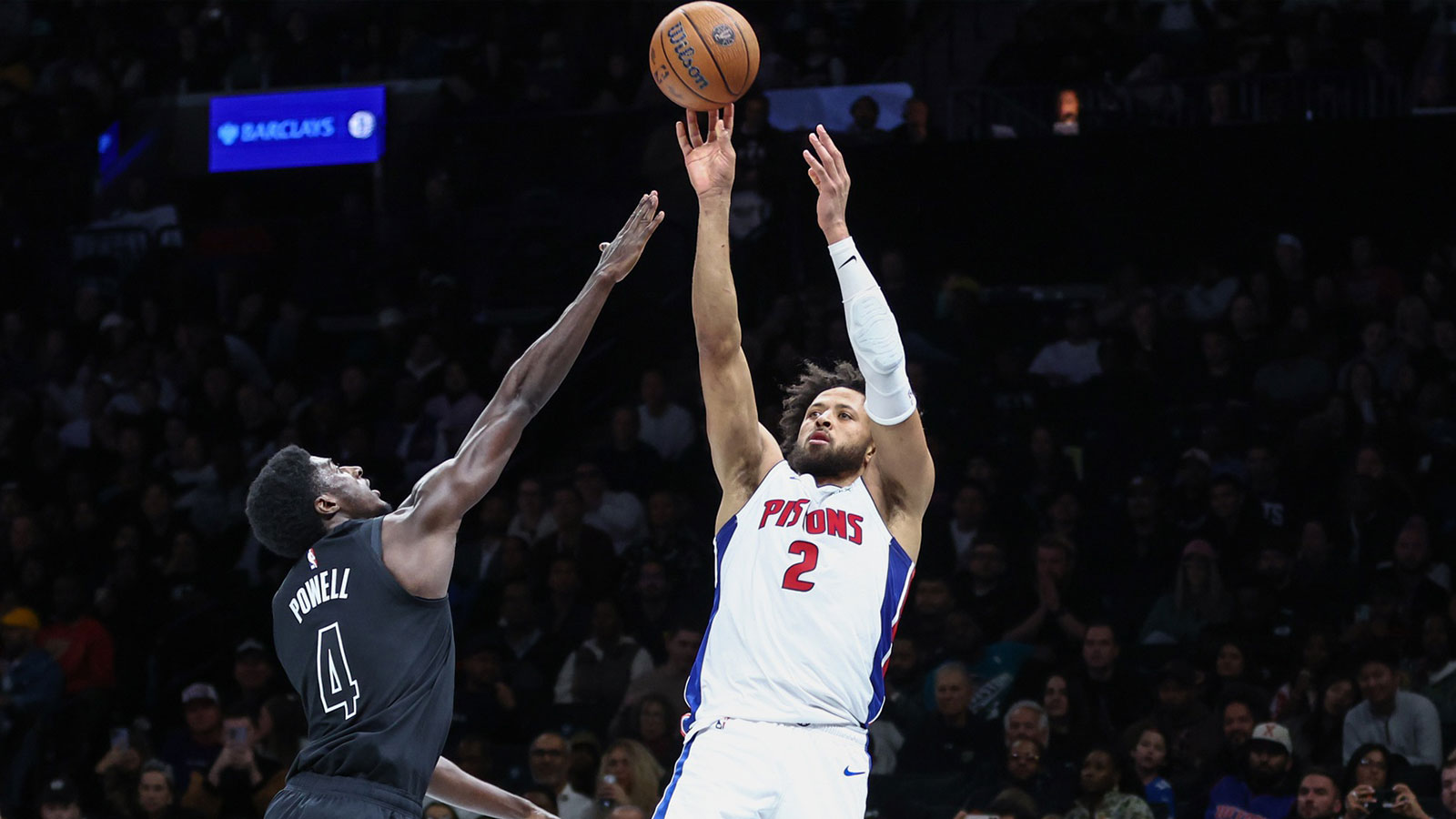 Detroit Pistons guard Cade Cunningham (2) takes a three point shot past Brooklyn Nets guard Drake Powell (4) in the second quarter at Barclays Center.
