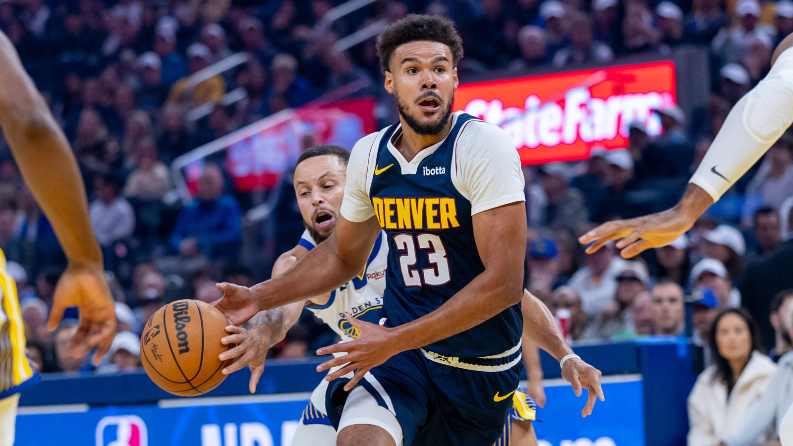 Denver Nuggets forward Cameron Johnson (23) drives with the ball against the Golden State Warriors during the first quarter at Chase Center.