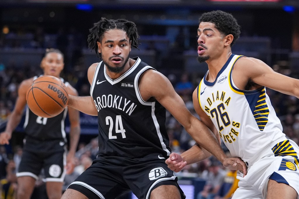 Cam Thomas, who exited with a left hamstring injury, drives on Ben Sheppard during the Nets' road win over the Pacers.
