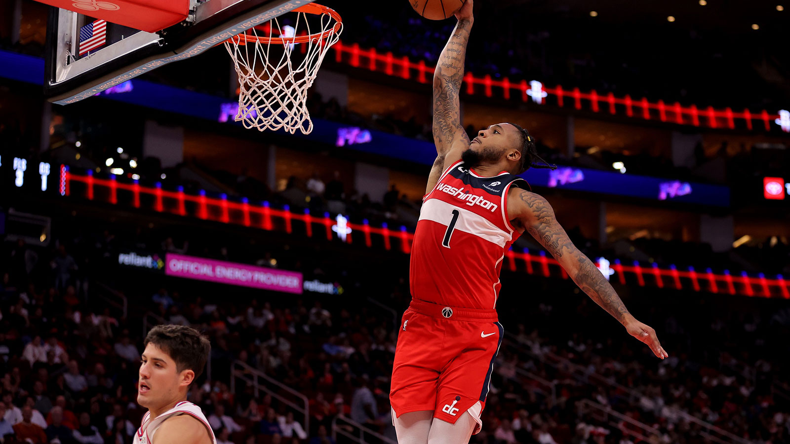 Washington Wizards forward Cam Whitmore (1) dunks against against the Houston Rockets during the third quarter at Toyota Center.
