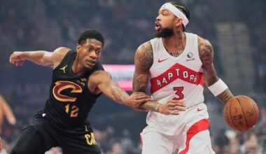 Cleveland Cavaliers' De'Andre Hunter (12) defends Toronto Raptors' Brandon Ingram (3) in the first half of an an NBA Cup basketball game in Cleveland, Friday, Oct. 31, 2025.
