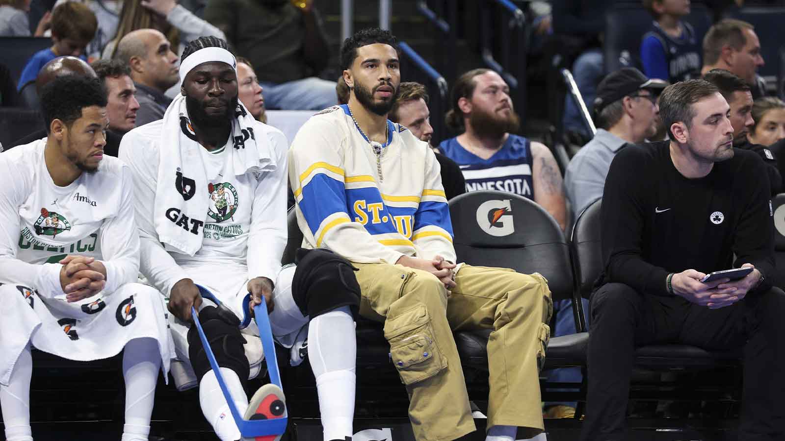 Celtics forward Jayson Tatum (0) (center) looks on during a game against the Orlando Magic in the first quarter at Kia Center
