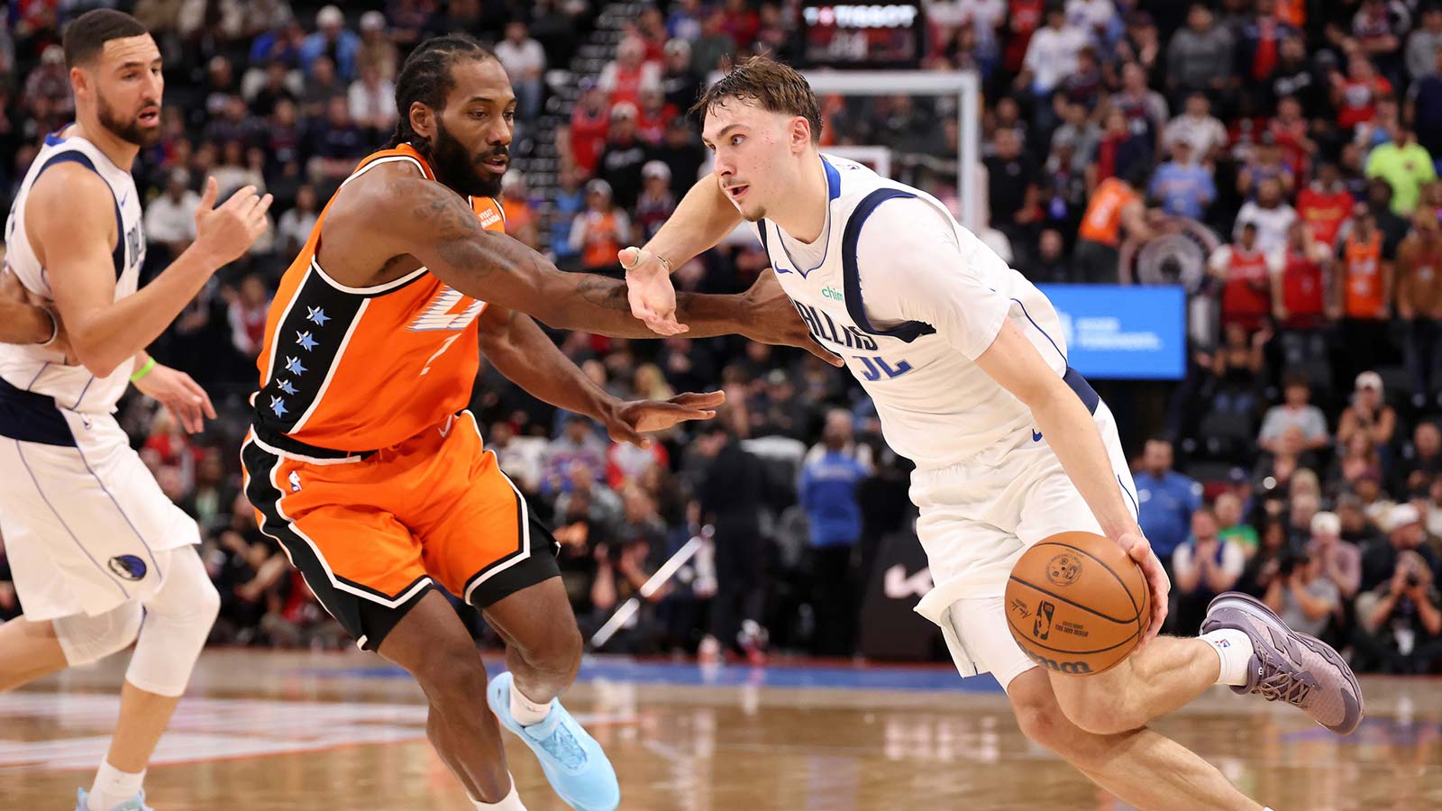 Dallas Mavericks forward Cooper Flagg (32) dribbles the ball against Los Angeles Clippers forward Kawhi Leonard (2) during the fourth quarter at Intuit Dome. Mandatory Credit: Kiyoshi Mio-Imagn Images
