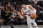 Portland Trail Blazers forward Deni Avdija (8) moves the ball while defended by Golden State Warriors guard Buddy Hield (7) during the first half of an NBA Cup basketball game, Friday, Nov. 21, 2025, in San Francisco.