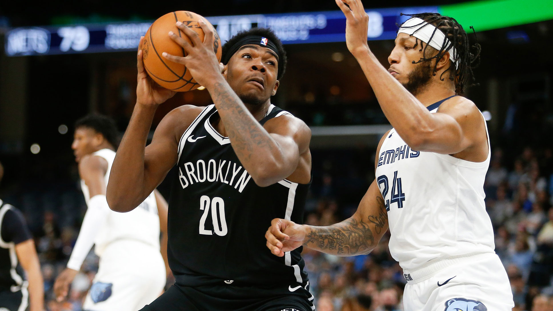 Brooklyn Nets center Day'Ron Sharpe (20) drives to the basket as Memphis Grizzlies forward Lamar Stevens (24) defends during the second half at FedExForum.