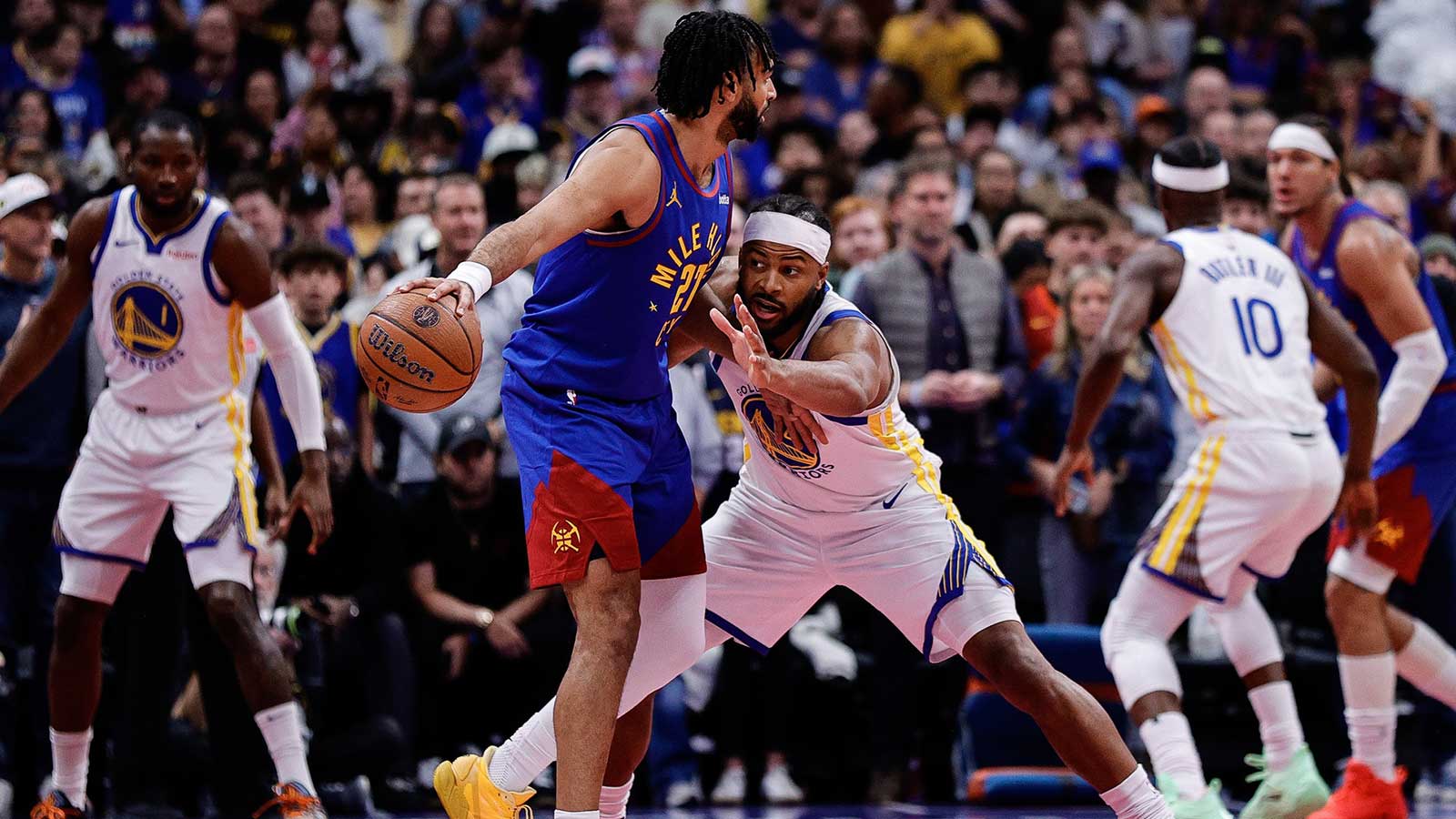 Denver Nuggets guard Jamal Murray (27) controls the ball as Golden State Warriors guard Moses Moody (4) guards in the first quarter at Ball Arena. 