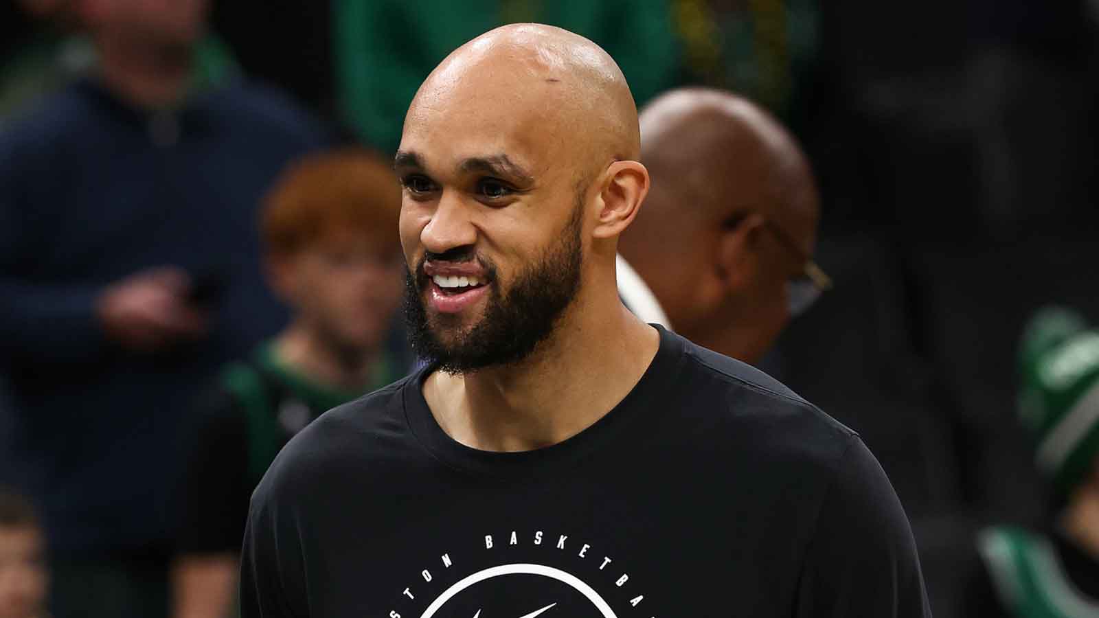 Boston Celtics guard Derrick White (9) smiles before their game against the Memphis Grizzlies at TD Garden.