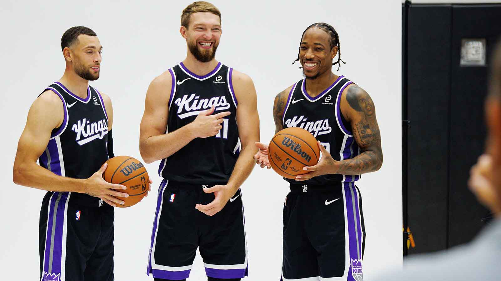 Sacramento Kings guard Zach LaVine (8), forward Domantas Sabonis (11), and forward DeMar DeRozan (10) pose for a photo during media day at Golden 1 Center. 
