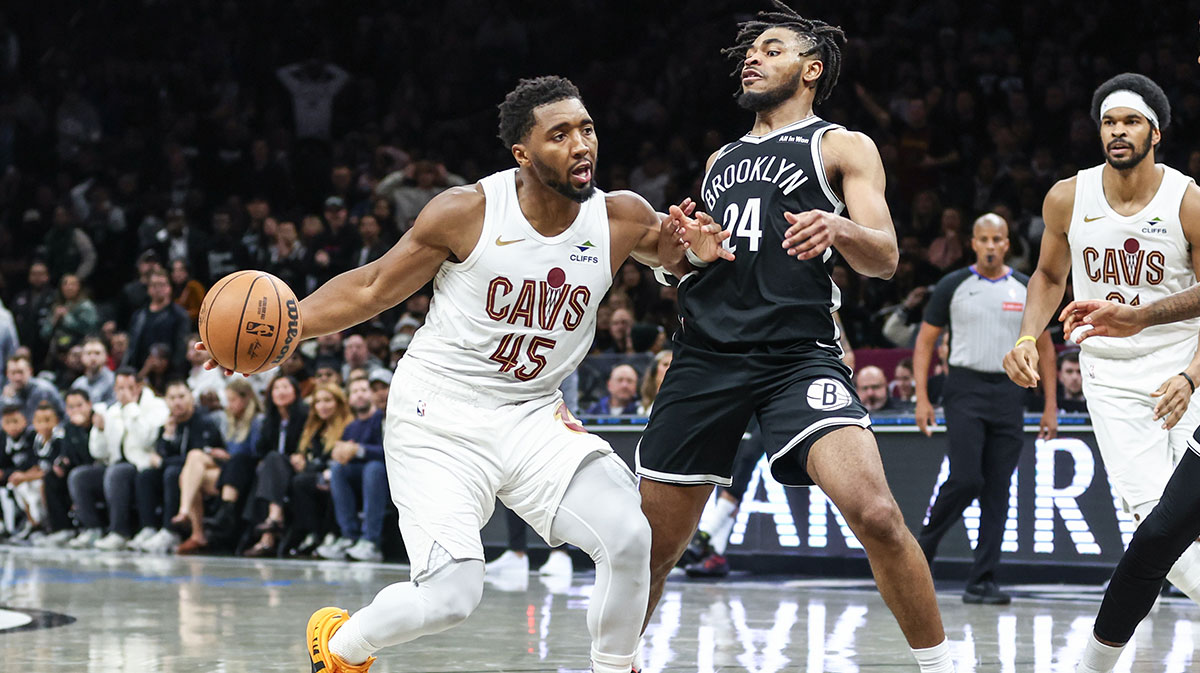 Cleveland Cavaliers guard Donovan Mitchell (45) looks to drive past Brooklyn Nets guard Cam Thomas (24) in the fourth quarter at Barclays Center.