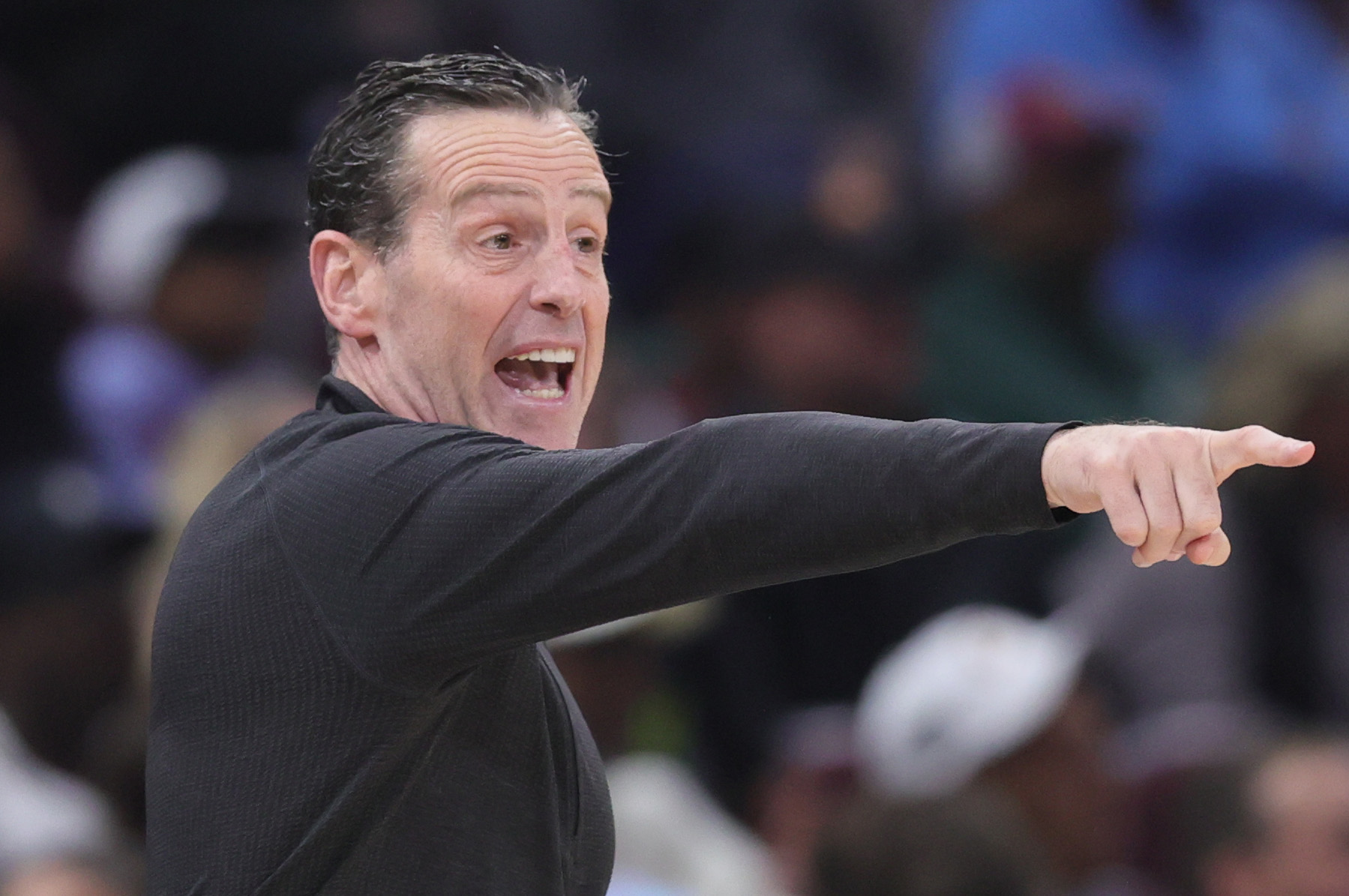 Cleveland Cavaliers head coach Kenny Atkinson calls out a play in the first half at Rocket Arena. 