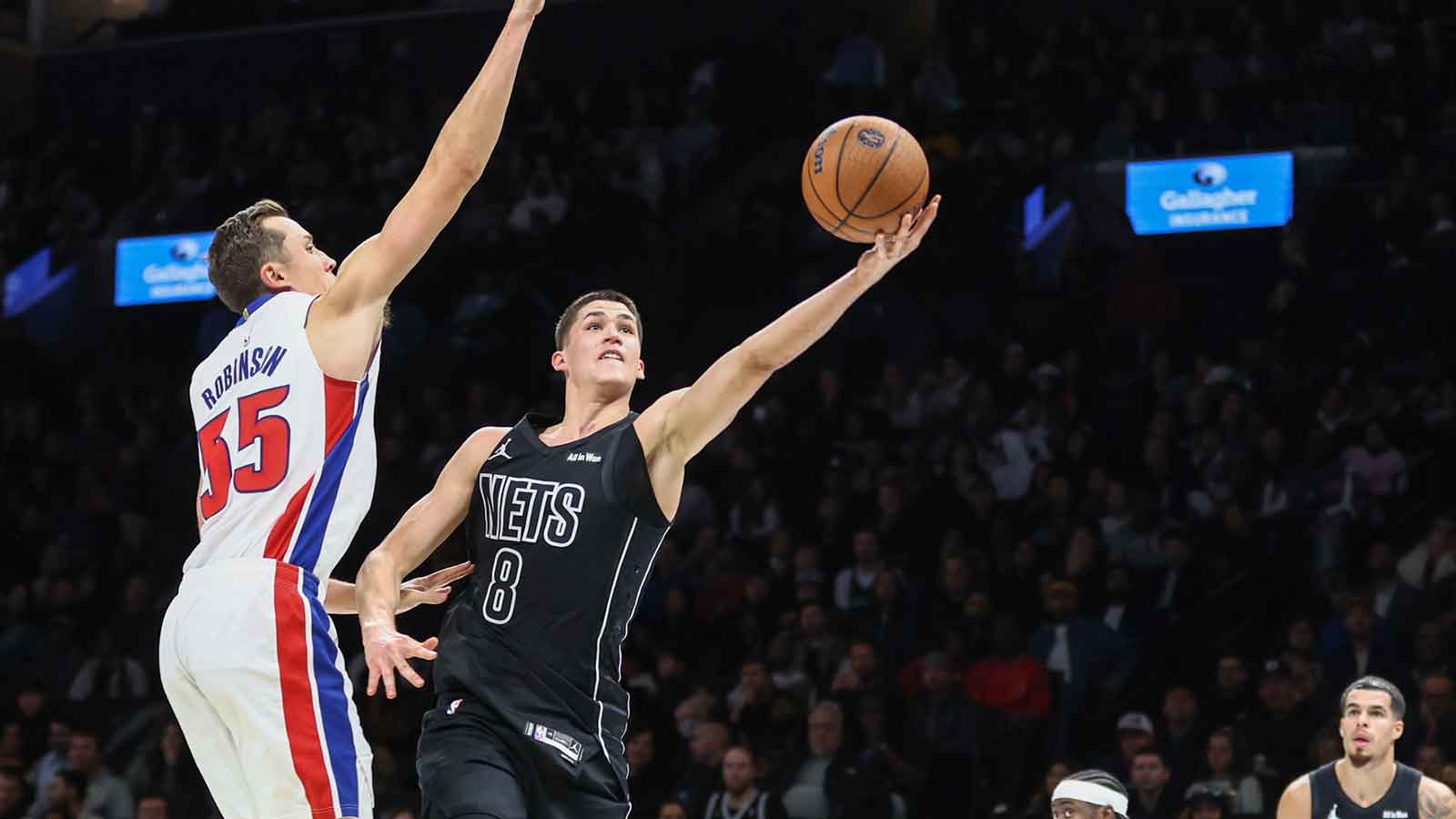 Brooklyn Nets guard Egor Demin (8) drives past Detroit Pistons forward Duncan Robinson (55) in the third quarter at Barclays Center.