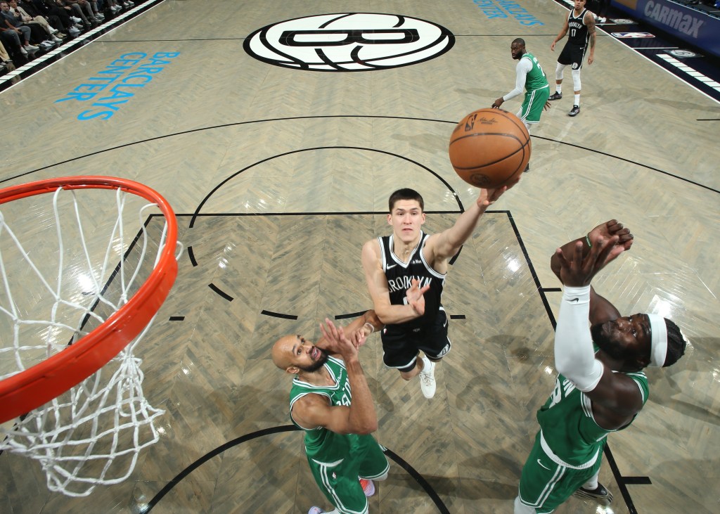 Egor Dëmin goes up for a layup during the Nets' blowout home loss to the Celtics.
