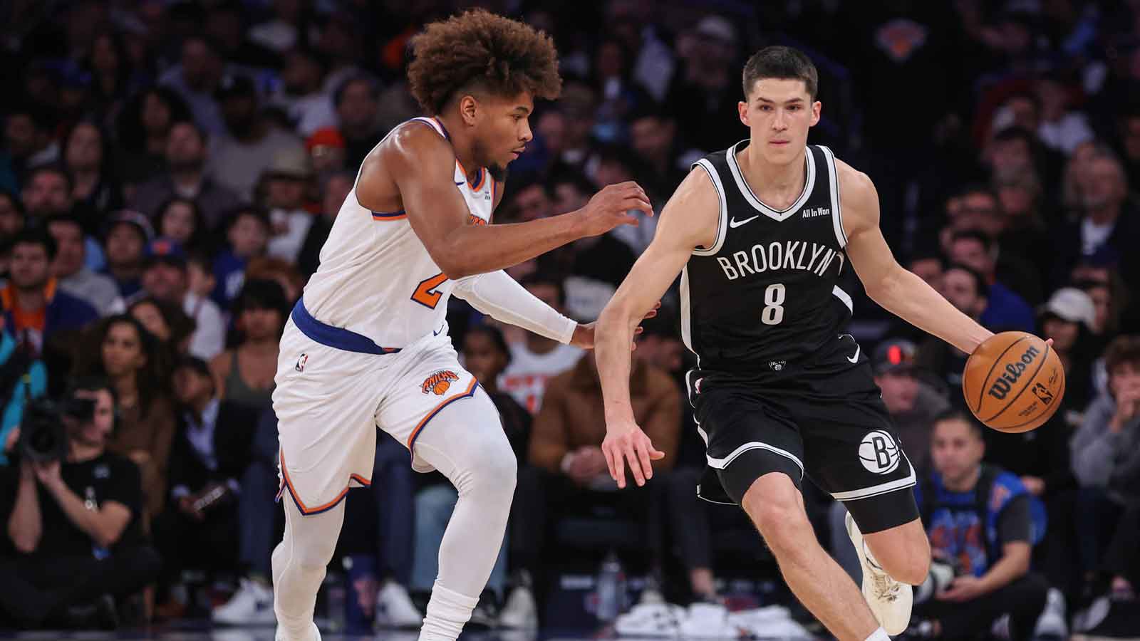 Nov 9, 2025; New York, New York, USA; Brooklyn Nets guard Egor Demin (8) looks to drive past New York Knicks guard Miles McBride (2) in the fourth quarter at Madison Square Garden. Mandatory Credit: Wendell Cruz-Imagn Images