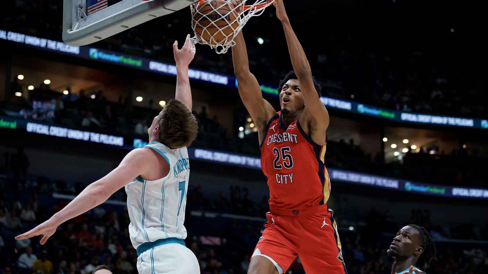 New Orleans Pelicans forward Trey Murphy III (25) dunks against Charlotte Hornets guard Kon Knueppel (7) during the first half at Smoothie King Center.