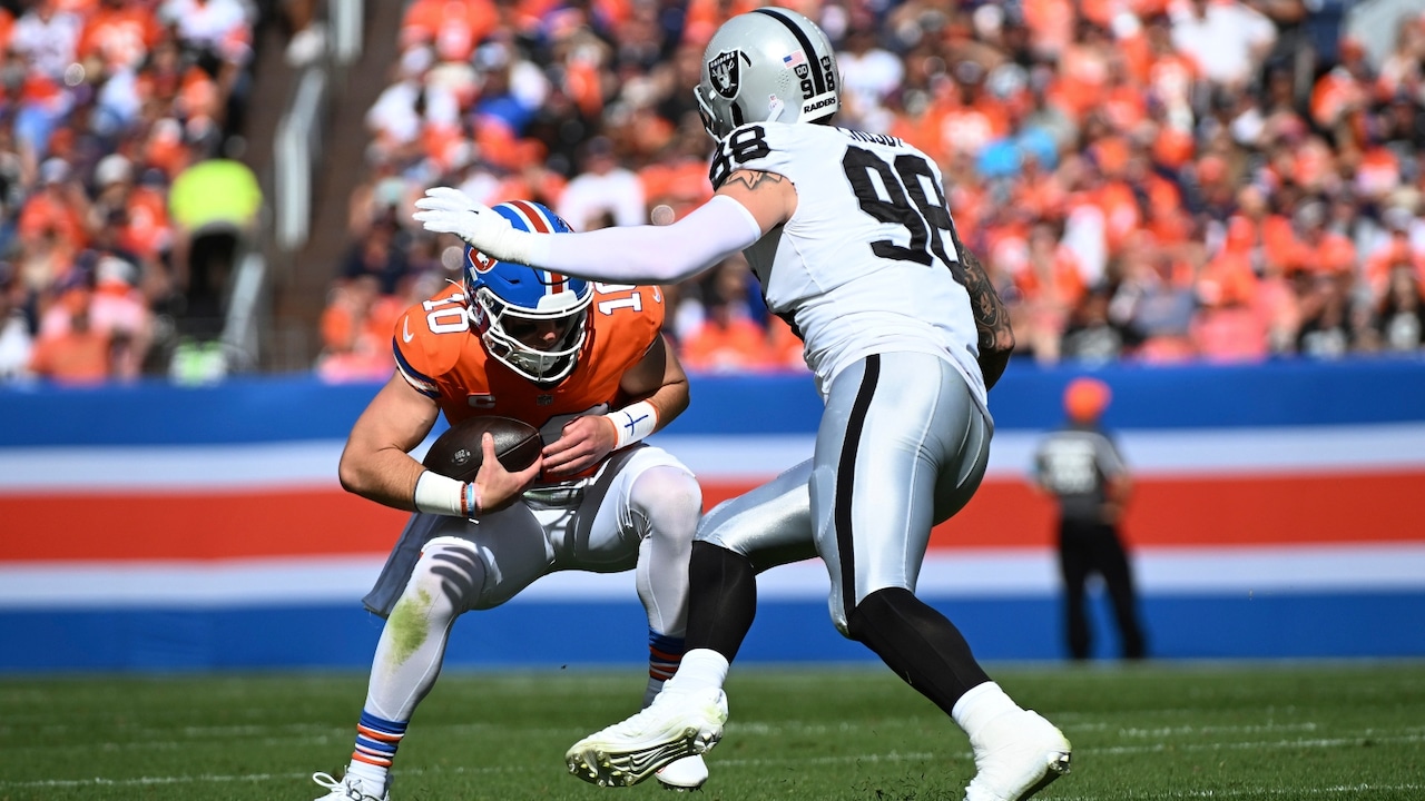Denver Broncos quarterback Bo Nix (10) is sacked by Las Vegas Raiders defensive end Maxx Crosby (98) during the first half of an NFL football game, Sunday, Oct. 6, 2024, in Denver