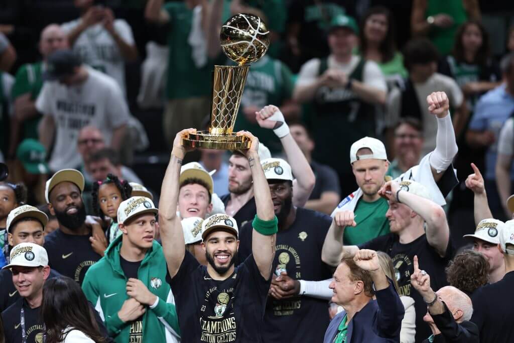 Jayson Tatum lifts the Larry O'Brien Trophy in June 2024.
