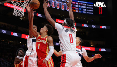 ATLANTA, GEORGIA - OCTOBER 28: Jalen Johnson #1 of the Atlanta Hawks draws a foul as he drives against Alexandre Sarr #20, Bilal Coulibaly #0 and Kyshawn George #18 of the Washington Wizards during the fourth quarter at State Farm Arena on October 28, 2024 in Atlanta, Georgia. NOTE TO USER: User expressly acknowledges and agrees that, by downloading and/or using this photograph, user is consenting to the terms and conditions of the Getty Images License Agreement. (Photo by Kevin C. Cox/Getty Images)