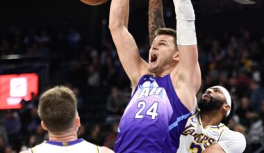 Walker Kessler #24 of the Utah Jazz dunks over Anthony Davis #3 of the Los Angeles Lakers...