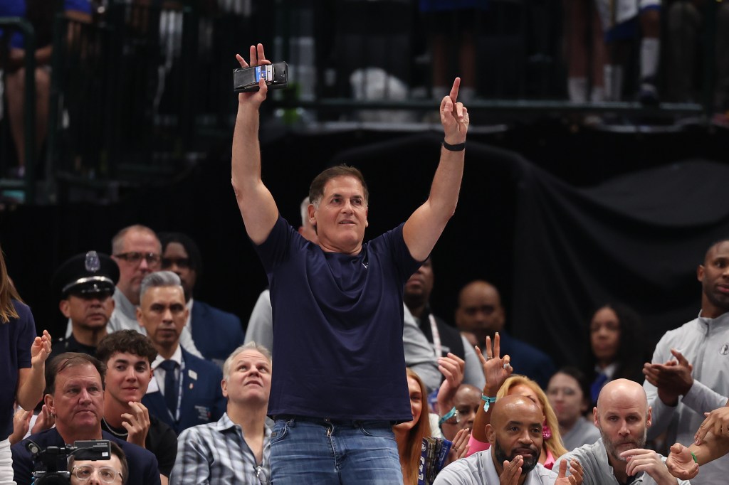  Mark Cuban reacts after the Dallas Mavericks score during the first half against the Toronto Raptors at American Airlines Center on April 11, 2025 in Dallas, Texas. 