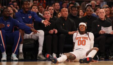 Jordan Clarkson #00 of the New York Knicks looks on as teammates react...