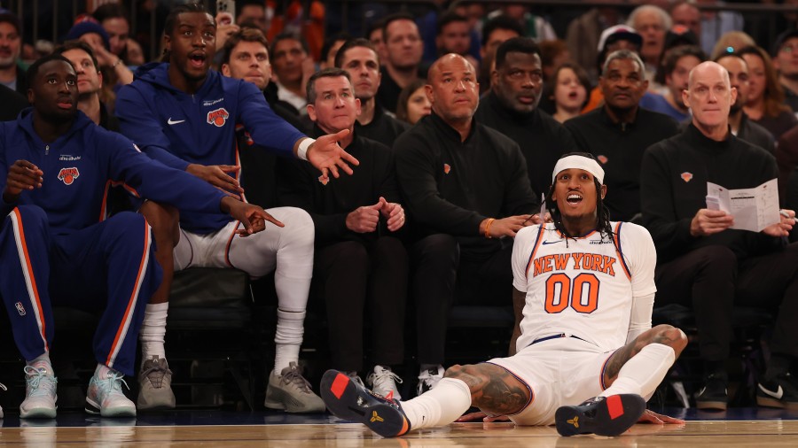 Jordan Clarkson #00 of the New York Knicks looks on as teammates react...