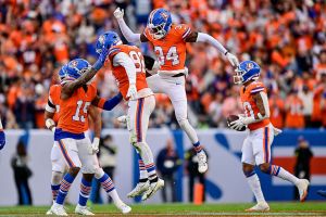 DENVER, COLORADO - OCTOBER 26: Dondrea Tillman #92 of the Denver Broncos celebrates with JL Skinner #34 and Nik Bonitto #15 after his fourth quarter interception against the Dallas Cowboys at Empower Field at Mile High on October 26, 2025 in Denver, Colorado. (Photo by Dustin Bradford/Getty Images)