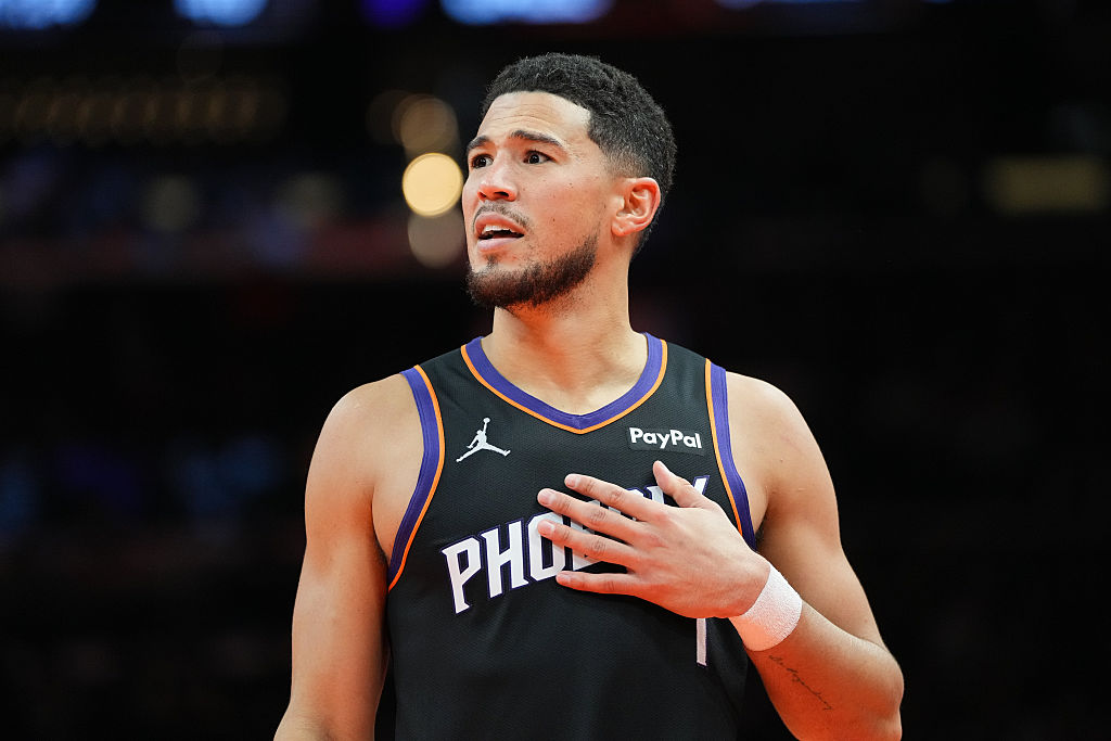 PHOENIX, ARIZONA - OCTOBER 31: Devin Booker #1 of the Phoenix Suns looks on during the second half of the Emirates NBA Cup game against the Utah Jazz at Mortgage Matchup Center on October 31, 2025 in Phoenix, Arizona. The Suns defeated the Jazz 118-96. NOTE TO USER: User expressly acknowledges and agrees that, by downloading and/or using this photograph, user is consenting to the terms and conditions of the Getty Images License Agreement. (Photo by Kelsey Grant/Getty Images)